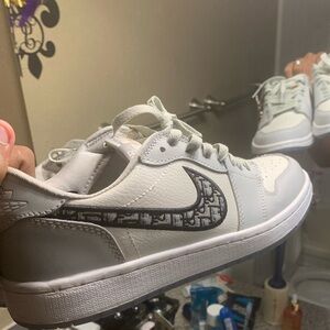 Dior men’s White Sneakers with Black Logo Accent